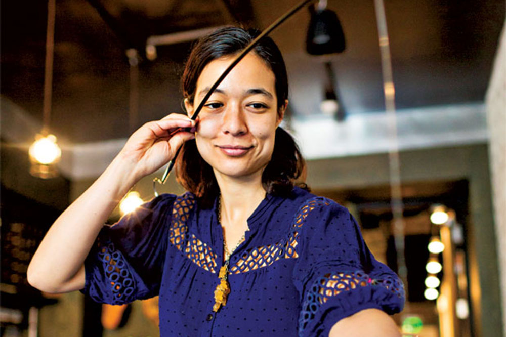 Chantal Tseng holding a venencia, used for pulling sherry samples from aging barrels. Photo courtesy of subject..jpg