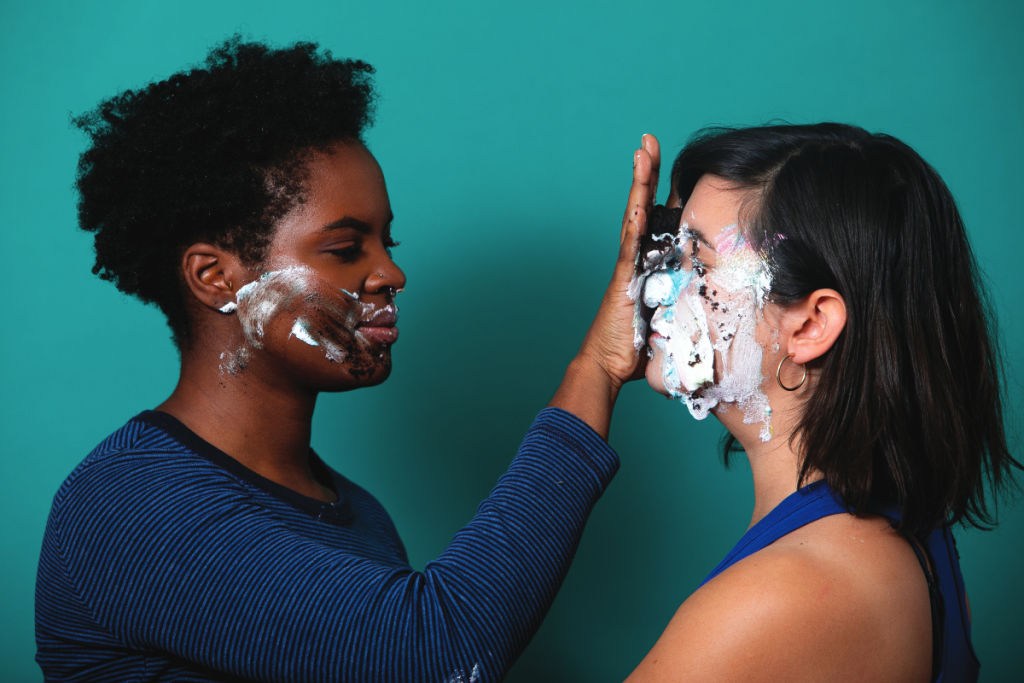D.C. Dance Companies: A darlingdance performer smears icing on another's face.