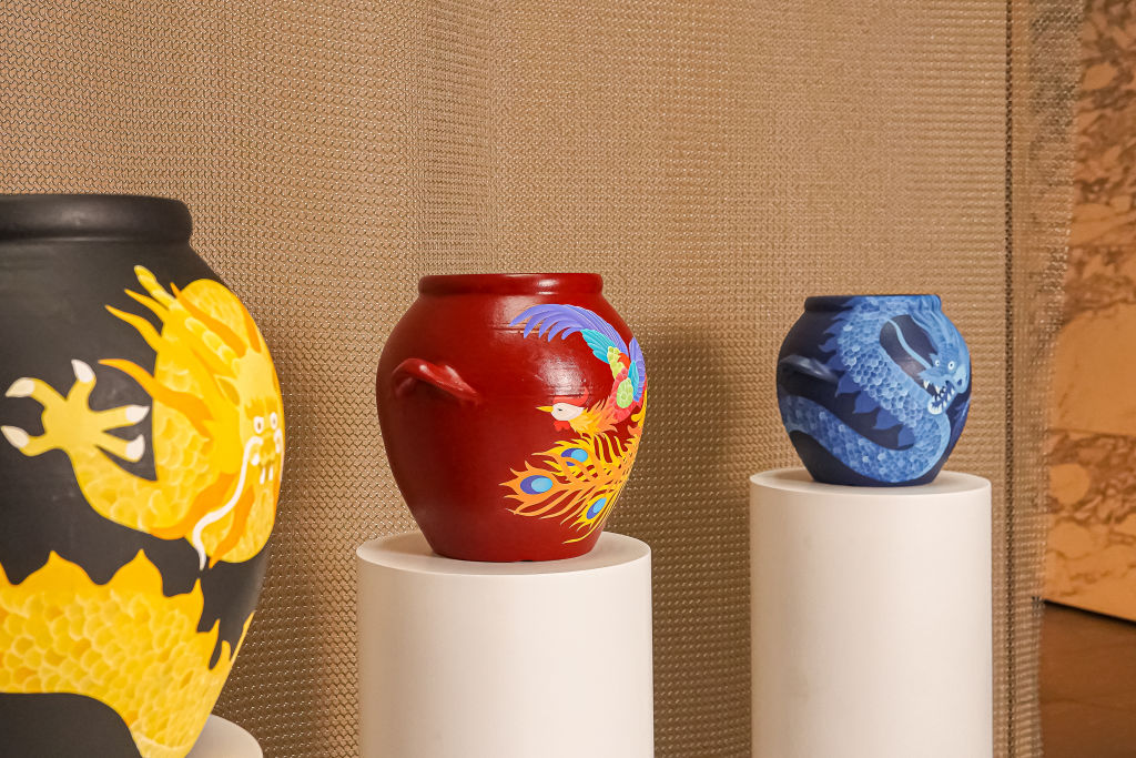 Three of Julia Chon's painted kimchi jars.