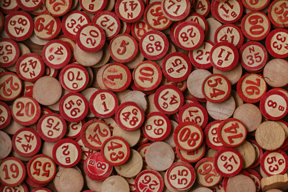 A large pile of red and white bingo chips.