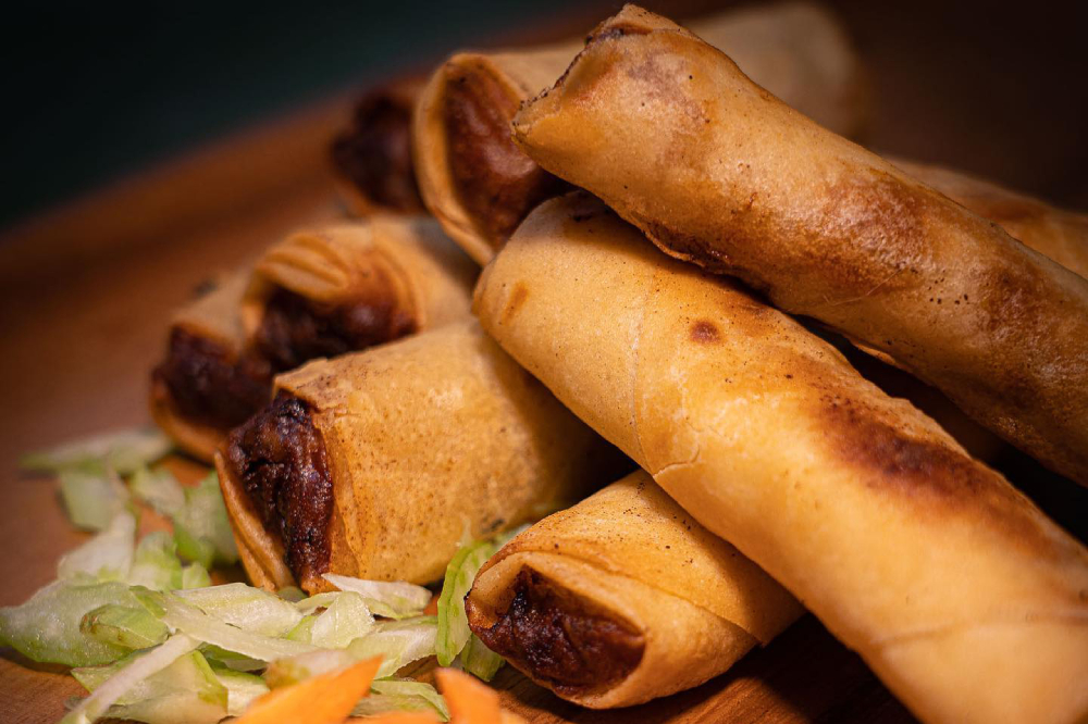 Several lumpia rest in a pile.