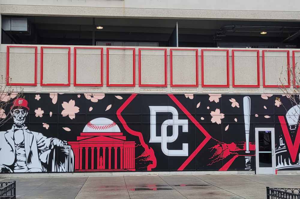 A blue and red mural that says "DC" in the center