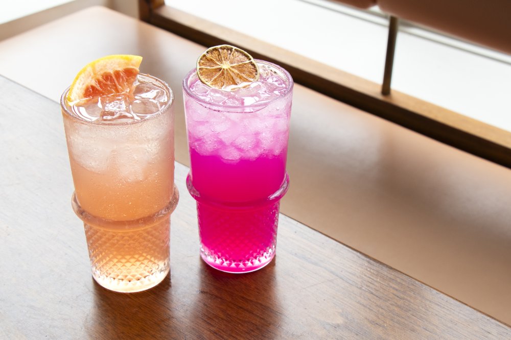Summery cocktails sit on a table at Unconventional Diner.