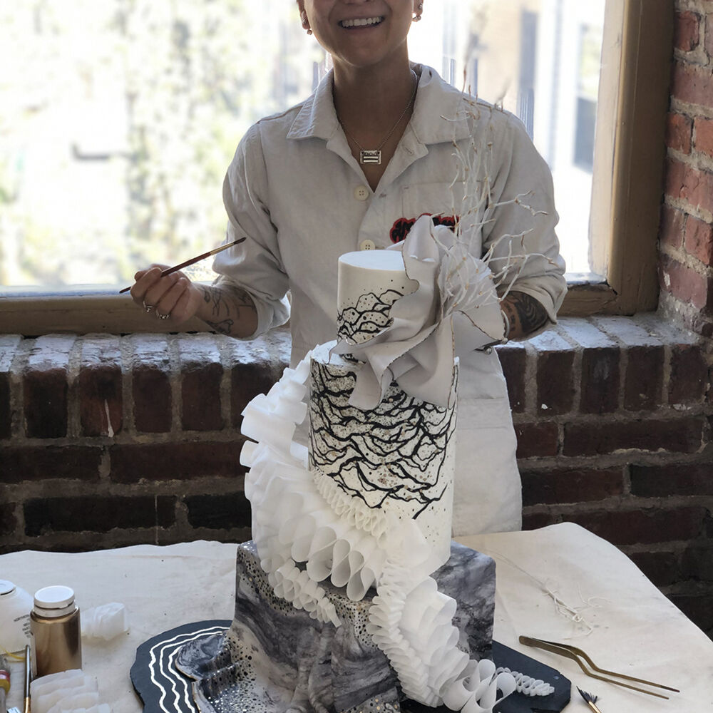 Artist Emon Surakitkoson designs a Buttercream Bakery cake. Artist Emon Surakitkoson designs a Buttercream Bakery cake.