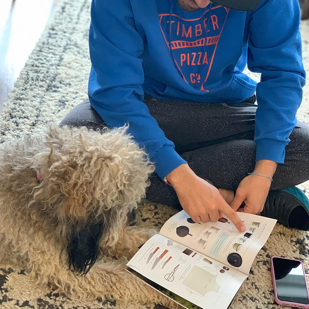 Call Your Mother Deli's Andrew Dana with pup. Call Your Mother Deli's Andrew Dana with pup.